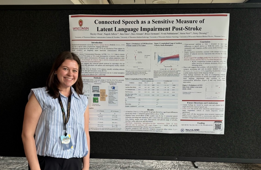 Hayley Olson, PhD with poster.